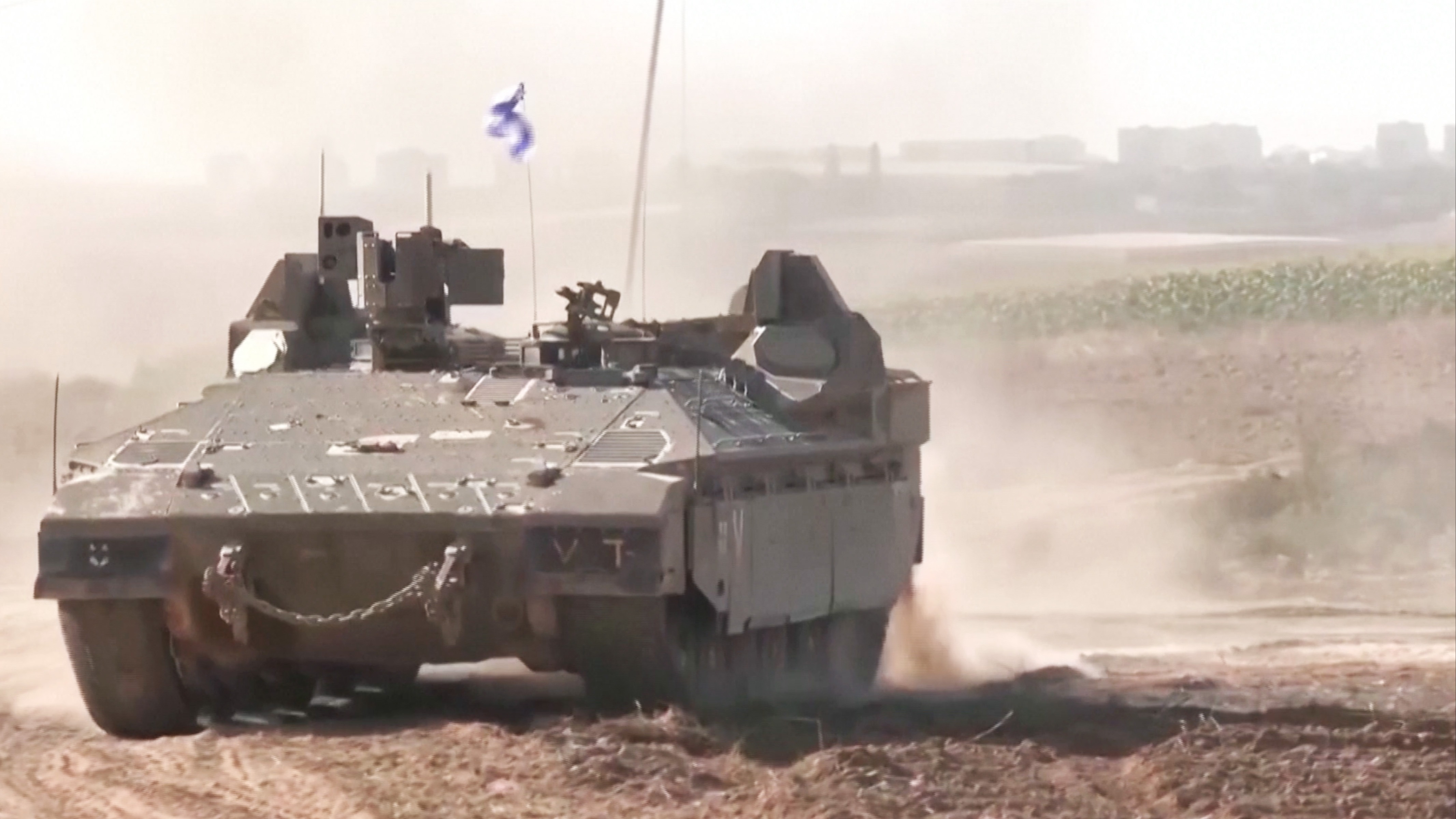 Israeli tanks and military vehicles moving in southern Israel on Friday