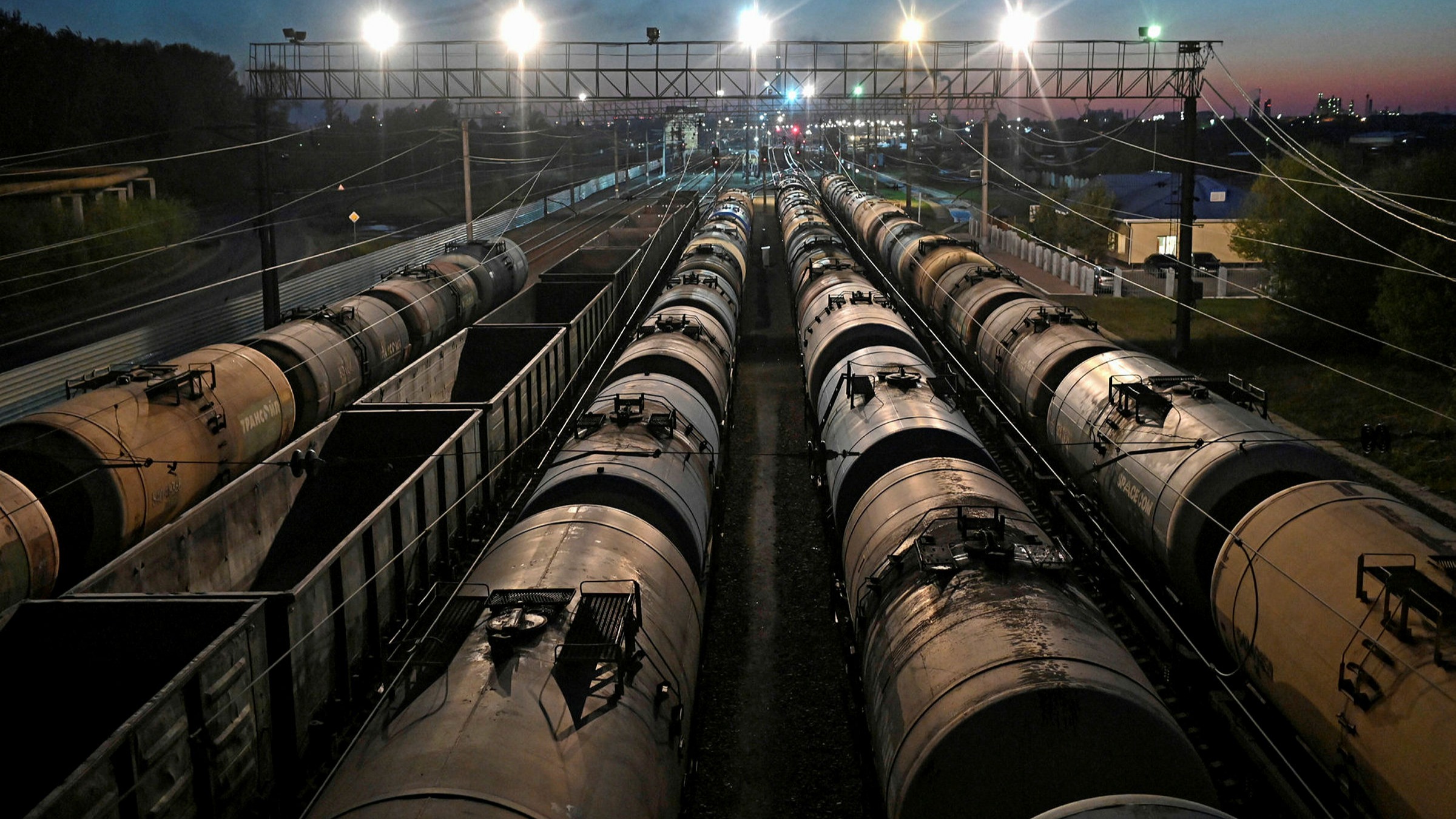 Virus resurgence could plunge emerging economies into debt crisis, warns IMF 1 Railroad freight cars, including oil tanks, in Omsk. Russia and other oil exporters face trade balance losses this year of more than 3% of GDP, the IMF warns