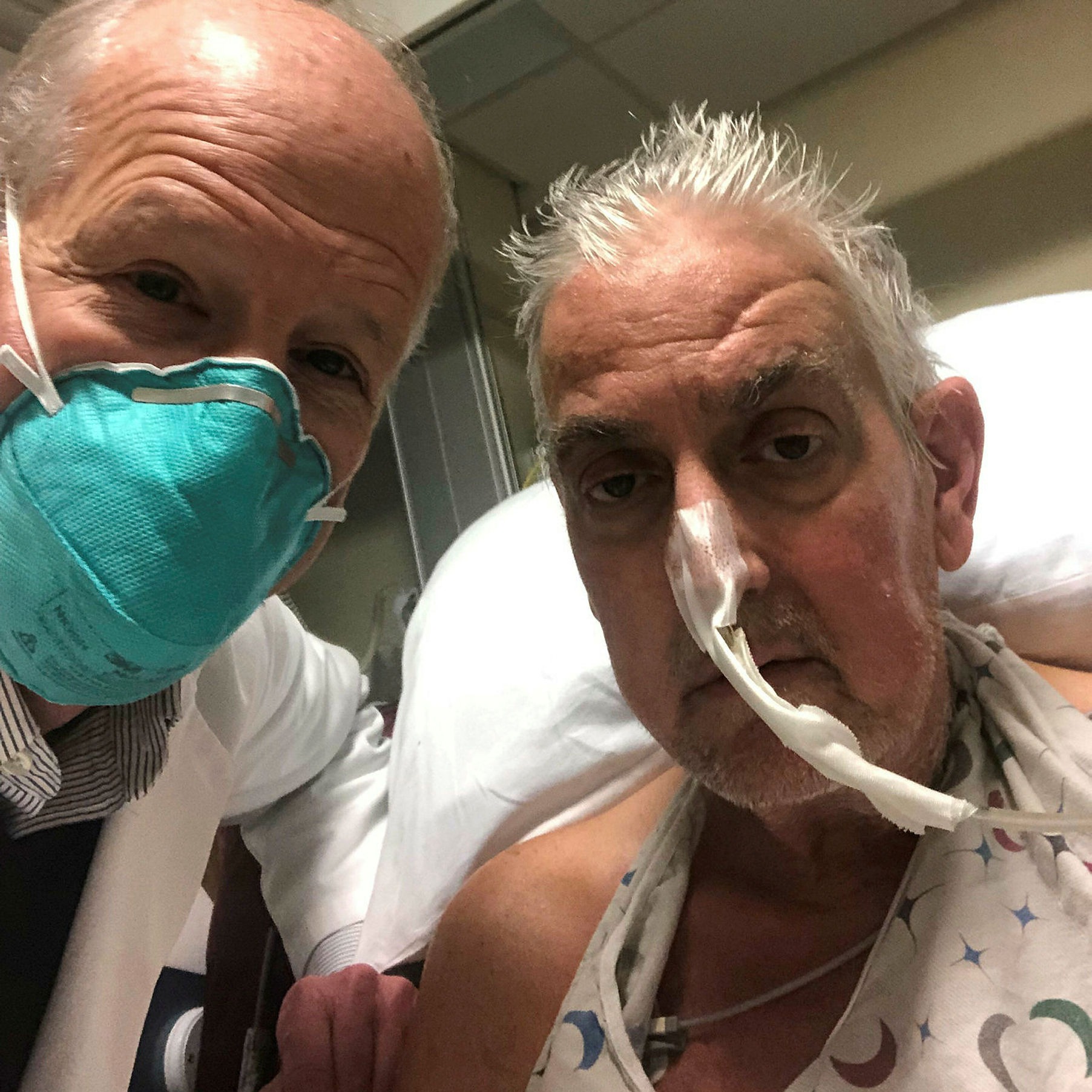 Surgeon Bartley Griffith, left, with patient Dave Bennett, who received a pig heart at the University of Maryland Medical Center last month