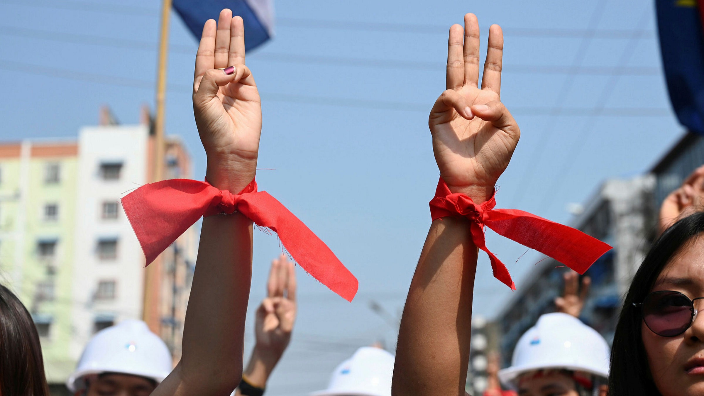 Результат пошуку зображень за запитом Tens of thousands of people gathered in Myanmar on Sunday in red and with three fingers