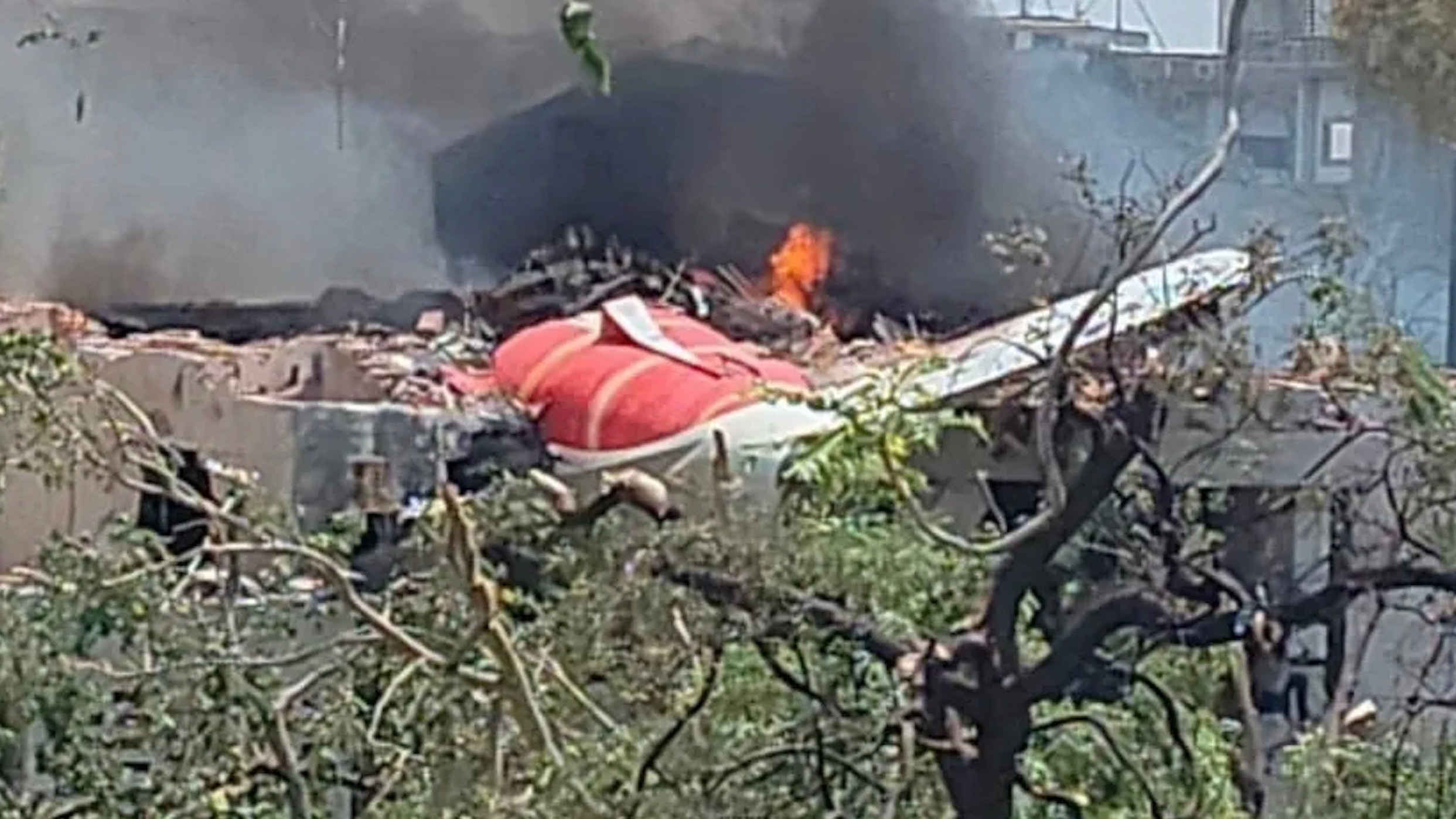 Air India flight to London carrying 242 people crashes in Ahmedabad